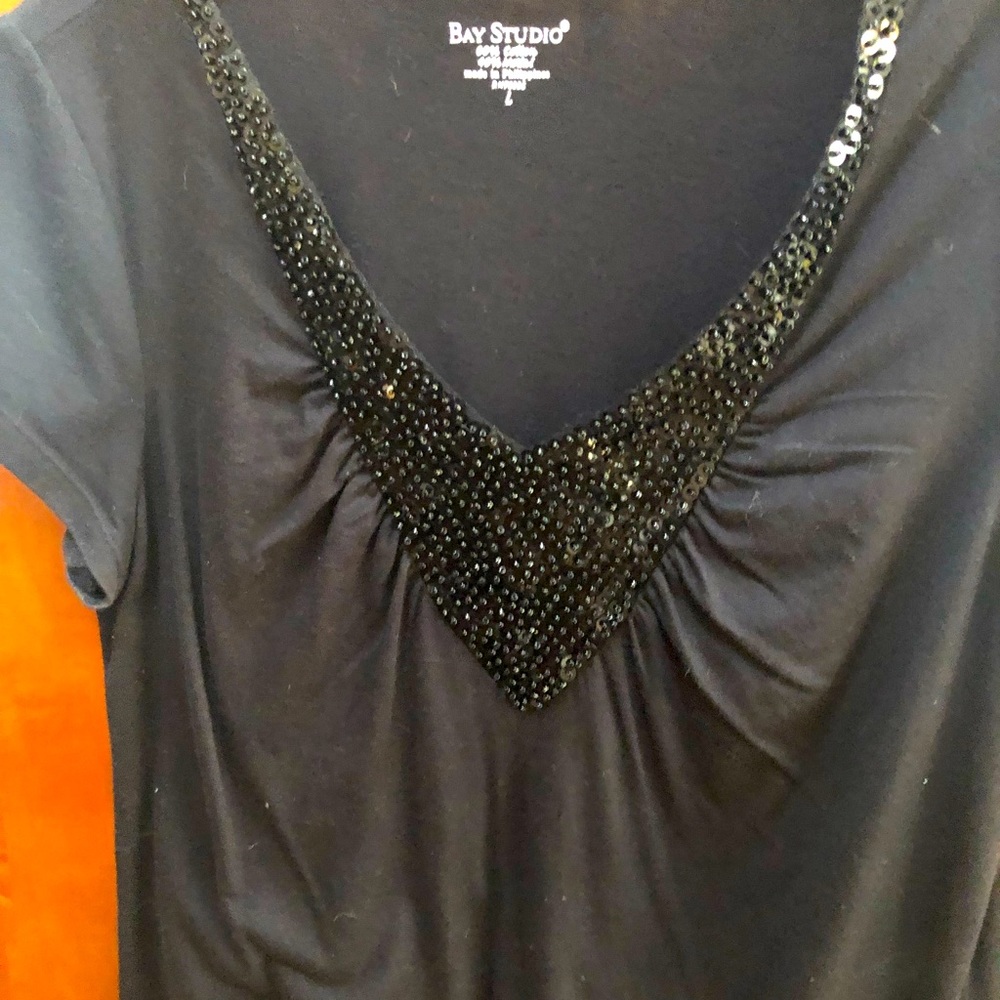 Black tee short sleeve with  BBM paillettes in front never worn brand Bay Studio